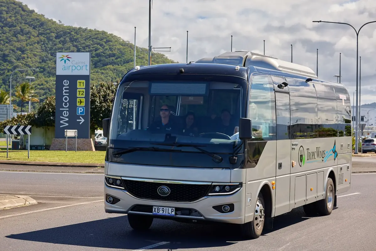 Tropic Wings shuttle coach at Cairns Airport ready for the Port Douglas run